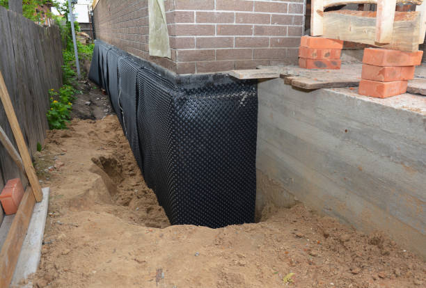 SJ Waterproofing Pros technician performing targeted Emergency Waterproofing assessment in Spring City, TN